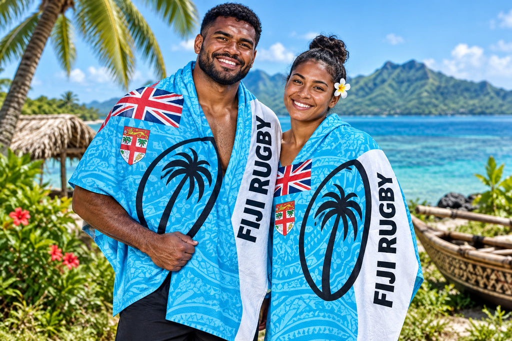 Fiji Rugby Sulu in bright blue patterned fabric with Fiji flags, palm tree motifs and white FIJI RUGBY bands